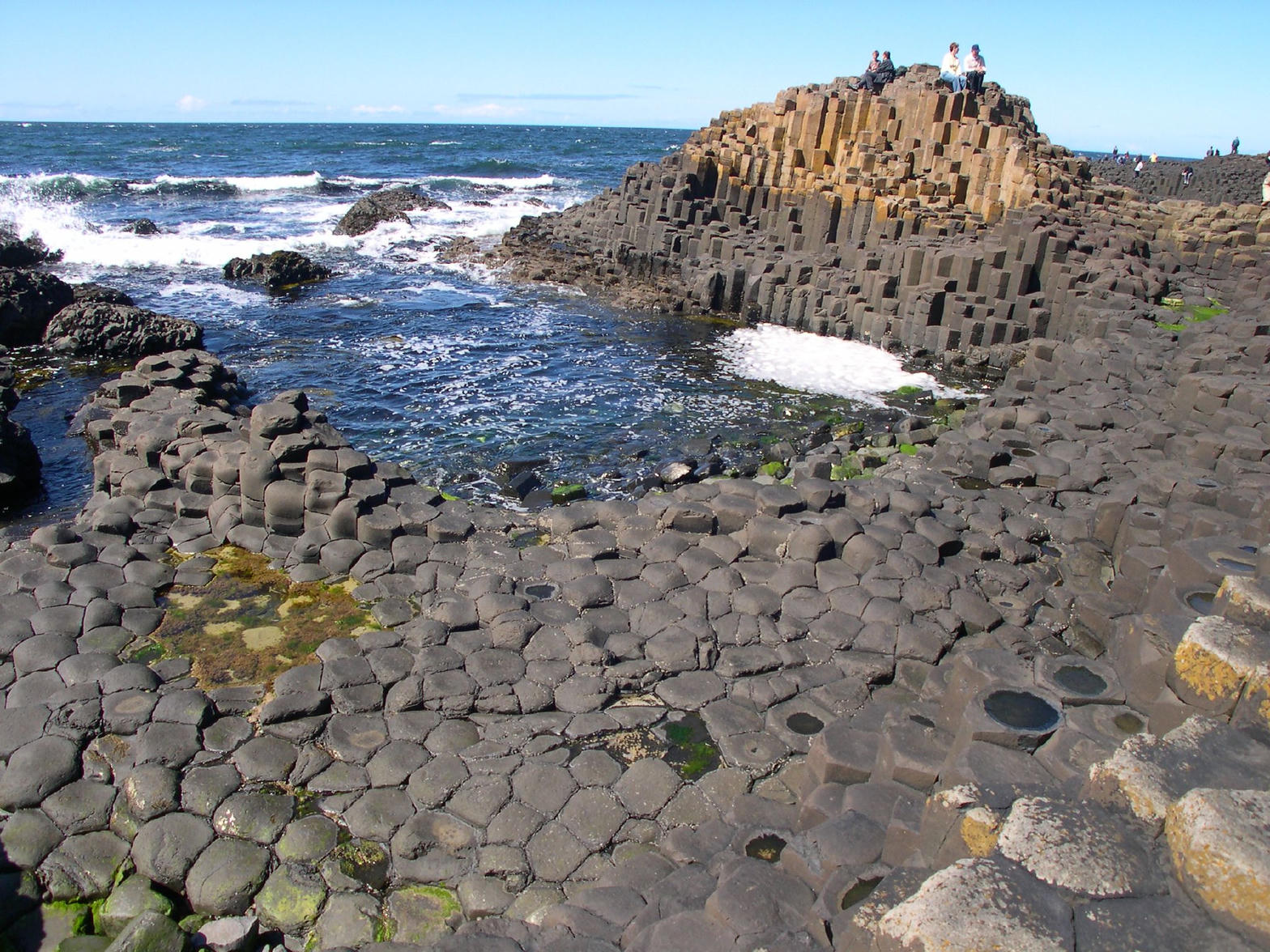The basalt columns of the Giant’s Causeway meeting the sea in County Antrim.